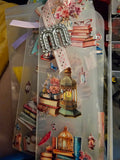 Decorative Handmade Unique Book Charm Bookmark lanterns, and decorative elements in a clear plastic packaging.