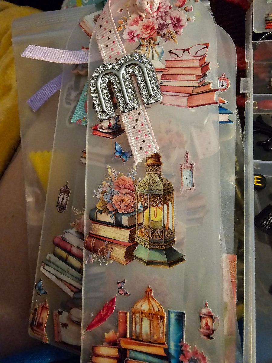 Decorative Handmade Unique Book Charm Bookmark lanterns, and decorative elements in a clear plastic packaging.