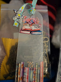 Decorative Handmade Unique Book Charm Bookmark with illustrations and charms in a clear package.