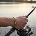handmade Fishing Lure Bracelet holding rod