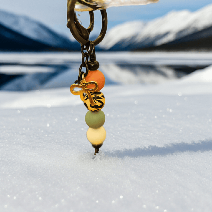 handmade gold bow charm keychain with colorful beads