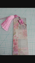 collection of five handmade bookmarks with botanical elements and tassels