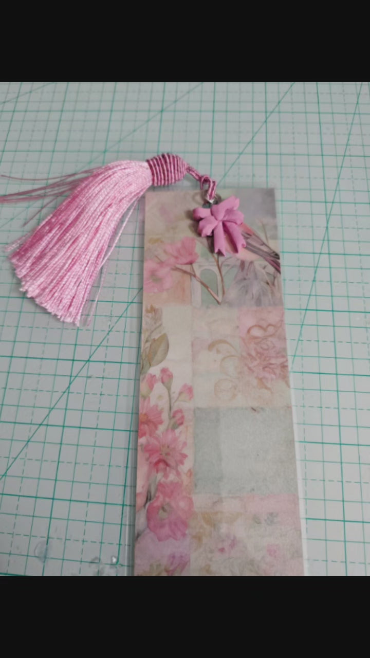 collection of five handmade bookmarks with botanical elements and tassels